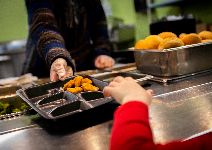  Student purchasing lunch tray